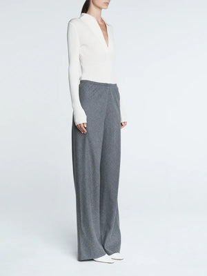 Close-up detail of the Bias Cut Trousers in Heather Grey, highlighting the Italian wool tweed texture.