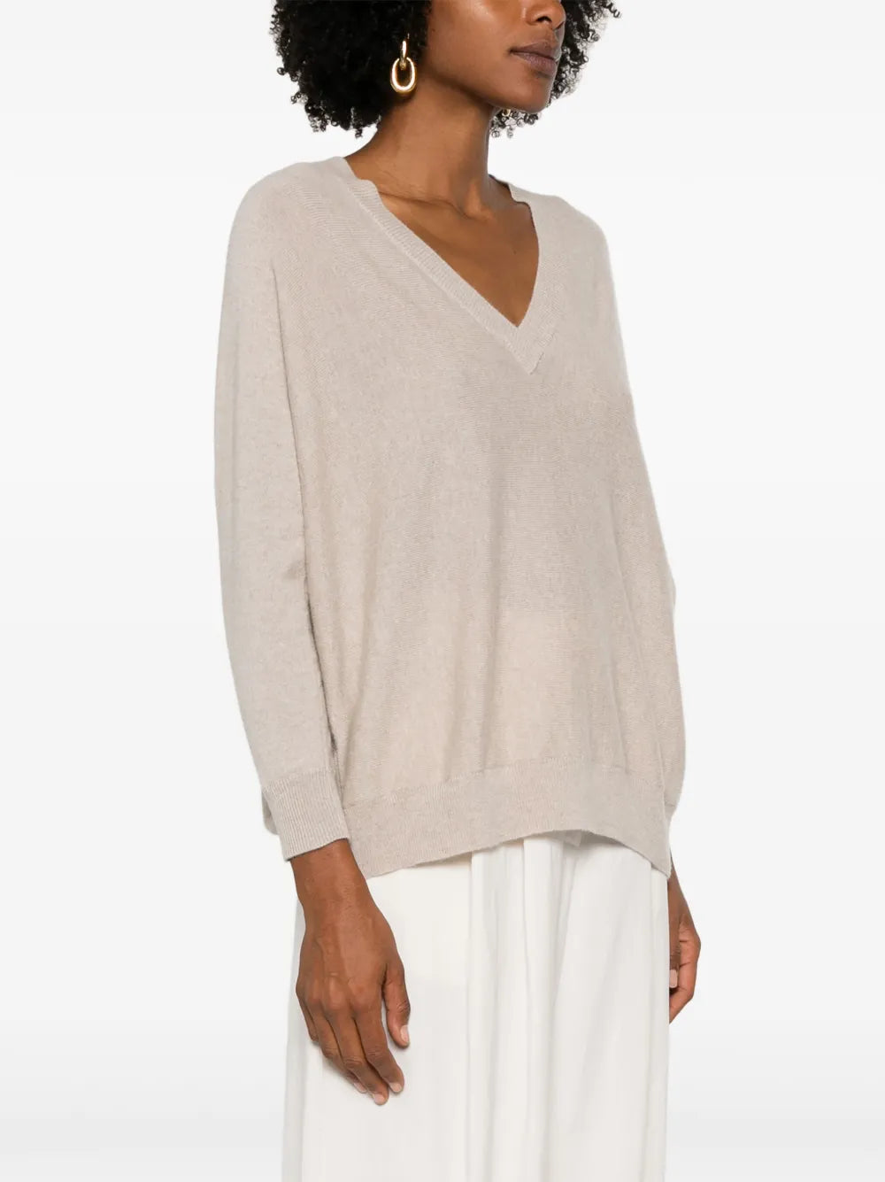 Close-up of the Kenny Sweater in Sand highlighting the detailed ribbed V-neckline and luxurious cashmere fabric.