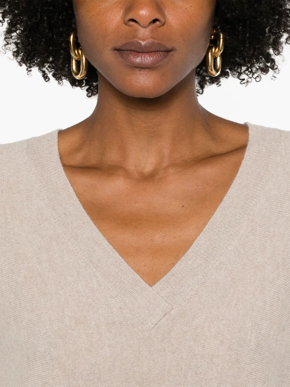 Kenny Sweater in Sand laid flat, emphasizing its fine-gauge cashmere blend and chic design.