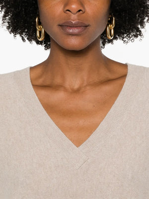 Kenny Sweater in Sand laid flat, emphasizing its fine-gauge cashmere blend and chic design.