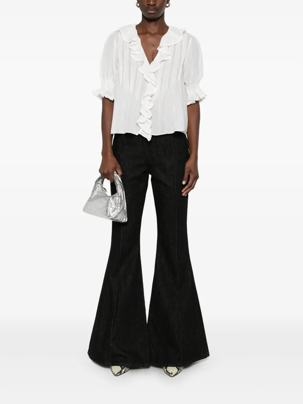Close-up of the intricate lace-trimmed ruffles on the Dôen Henri Top in Salt.