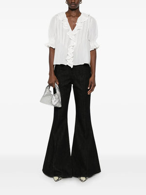Close-up of the intricate lace-trimmed ruffles on the Dôen Henri Top in Salt.