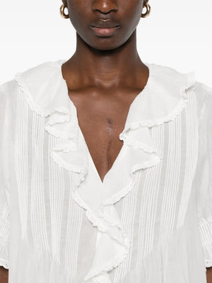 Casual styling idea for Dôen's Henri Top in Salt tucked into high-waisted jeans.