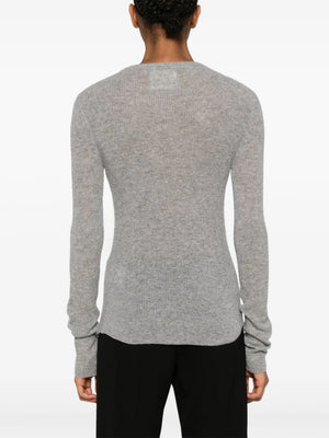 Woman wearing the Alessia Crewneck in Dark Heather Grey, highlighting its classic fit and versatility.
