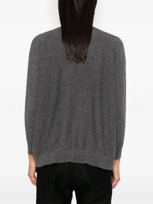 Model wearing the Kenny Sweater in Graphite by Lisa Yang, demonstrating its chic look and comfort.