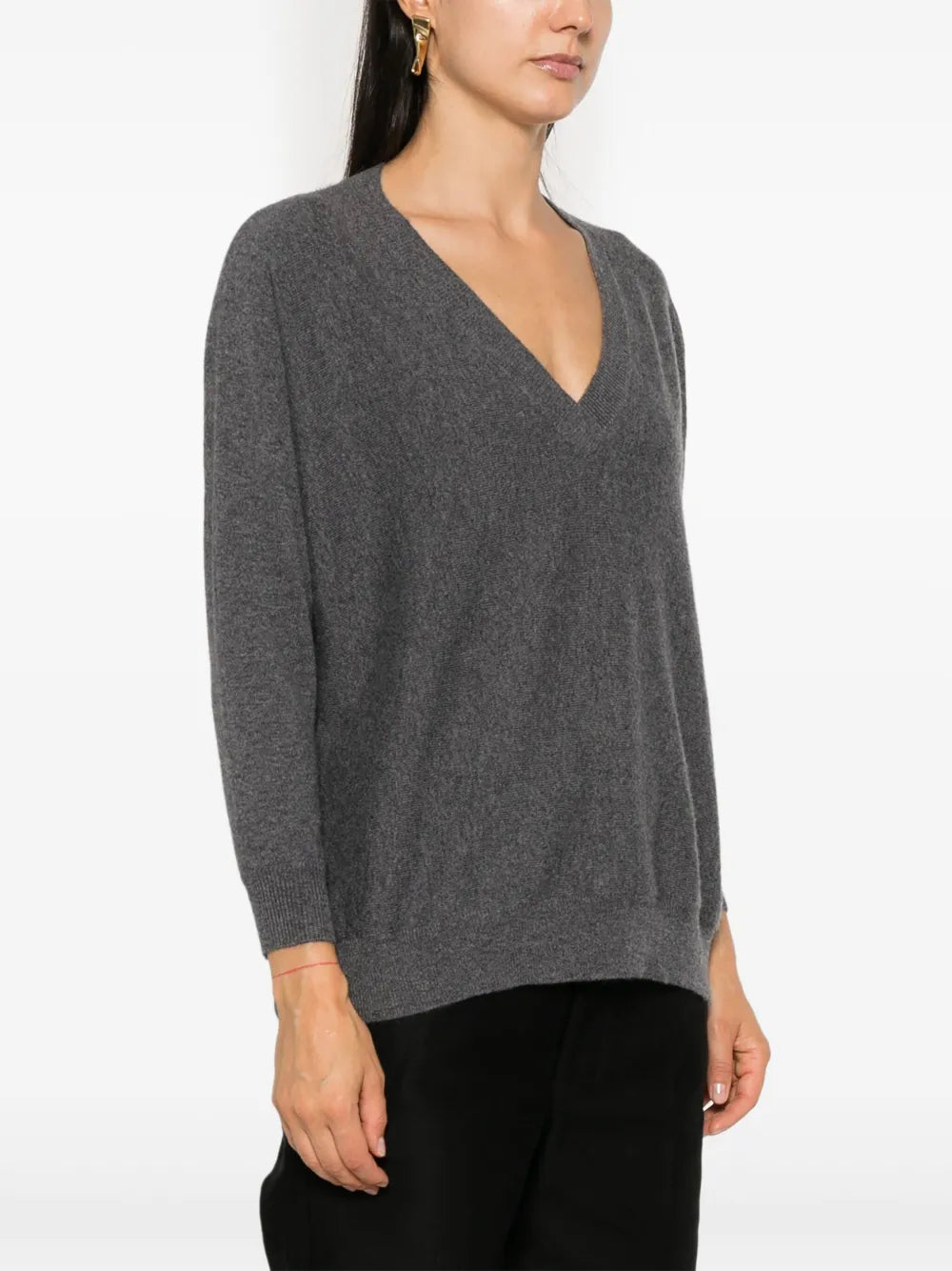 Kenny Sweater in Graphite styled casually over the shoulders, highlighting the relaxed fit and luxurious cashmere.