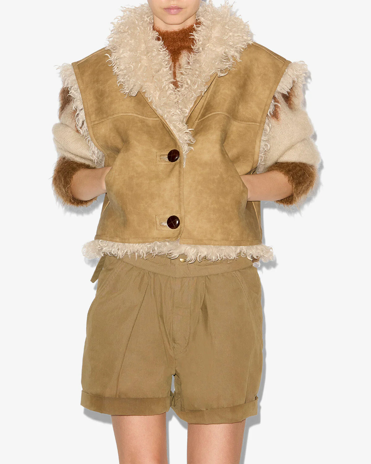 Model wearing the Clara Vest in Taupe, highlighting its cropped cut and cozy design.