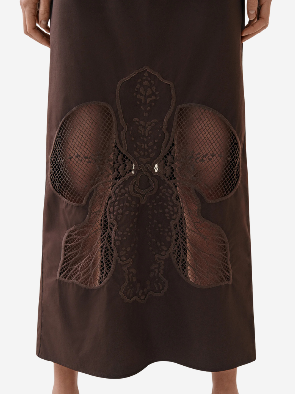 Flat lay of the Leonie Skirt in Arabica made of 100% cotton, featuring its intricate embroidery design.