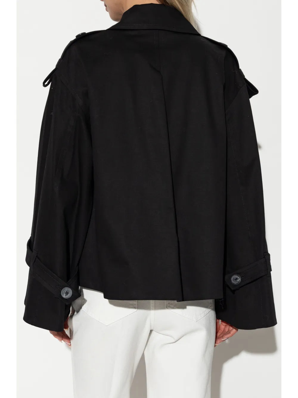 Alisandra Trench Jacket in Black displayed on a hanger, emphasizing its elegant design and versatility.
