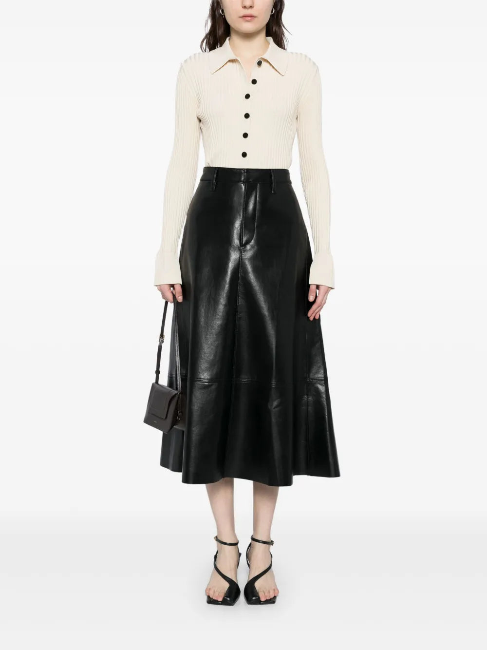 Close-up view of the Cassia Leather Skirt in Black, emphasizing the buttery texture and precise stitching.