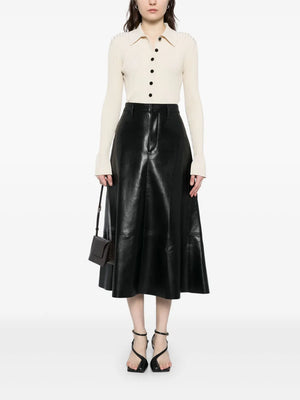 Close-up view of the Cassia Leather Skirt in Black, emphasizing the buttery texture and precise stitching.