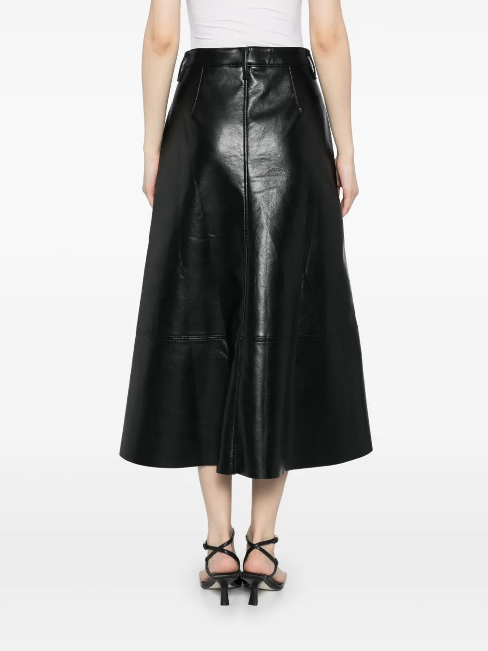 Styling options for the Cassia Leather Skirt in Black, paired with a soft knit sweater for a chic look.