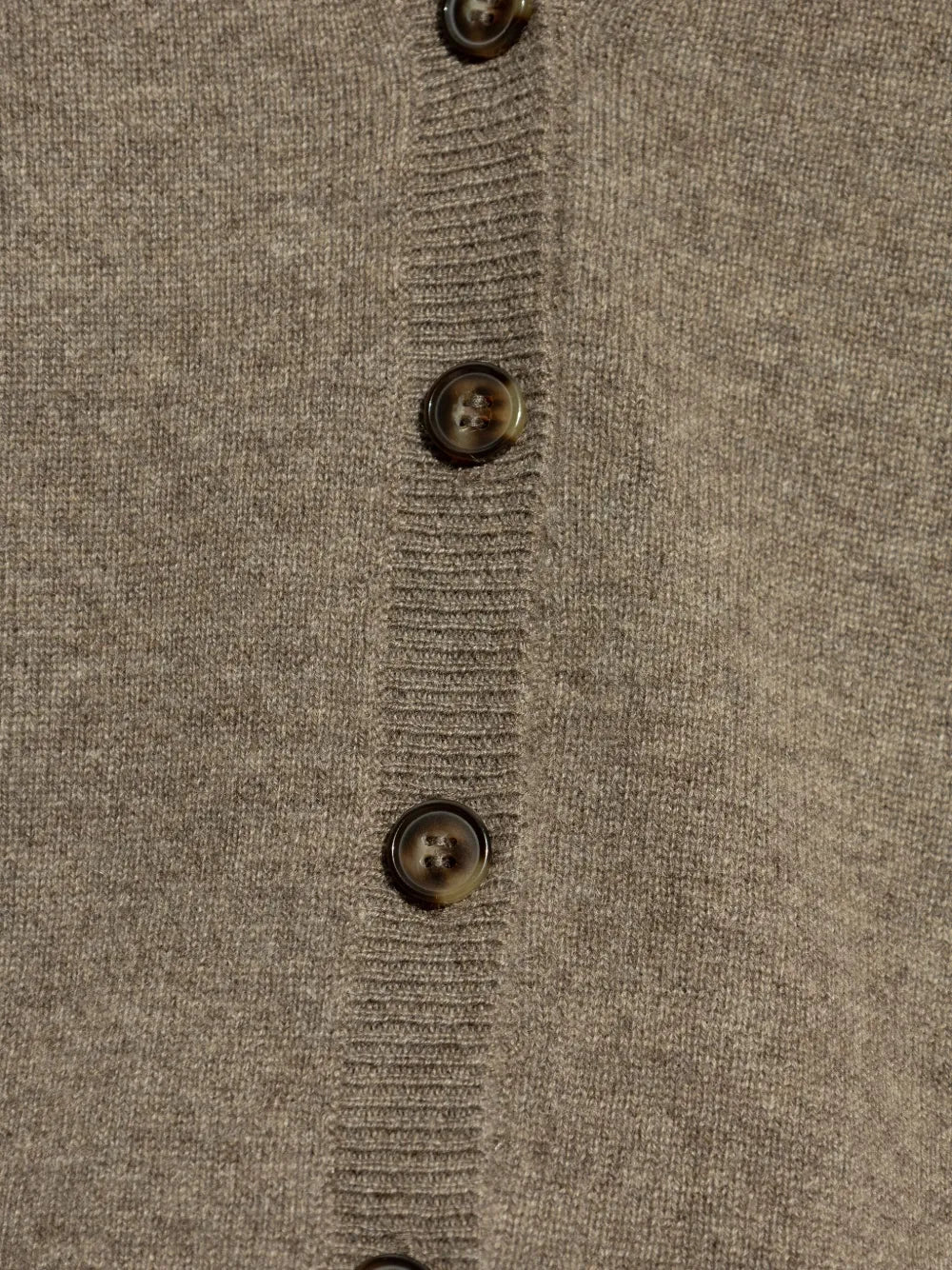 Lifestyle shot of the Abby Cardigan in Truffle, illustrating its versatility as a transseasonal fashion staple.