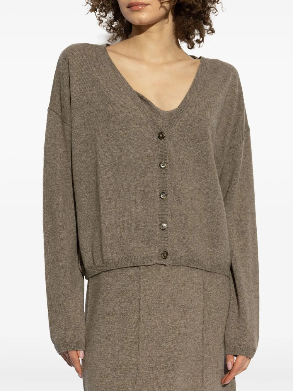 Model wearing the Abby Cardigan in Truffle by Lisa Yang, emphasizing its full-length sleeves and ribbed trims.