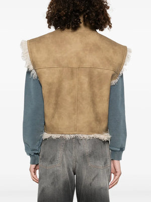 Model wearing Clara Vest in Taupe by Isabel Marant, perfect for layering in casual outfits.