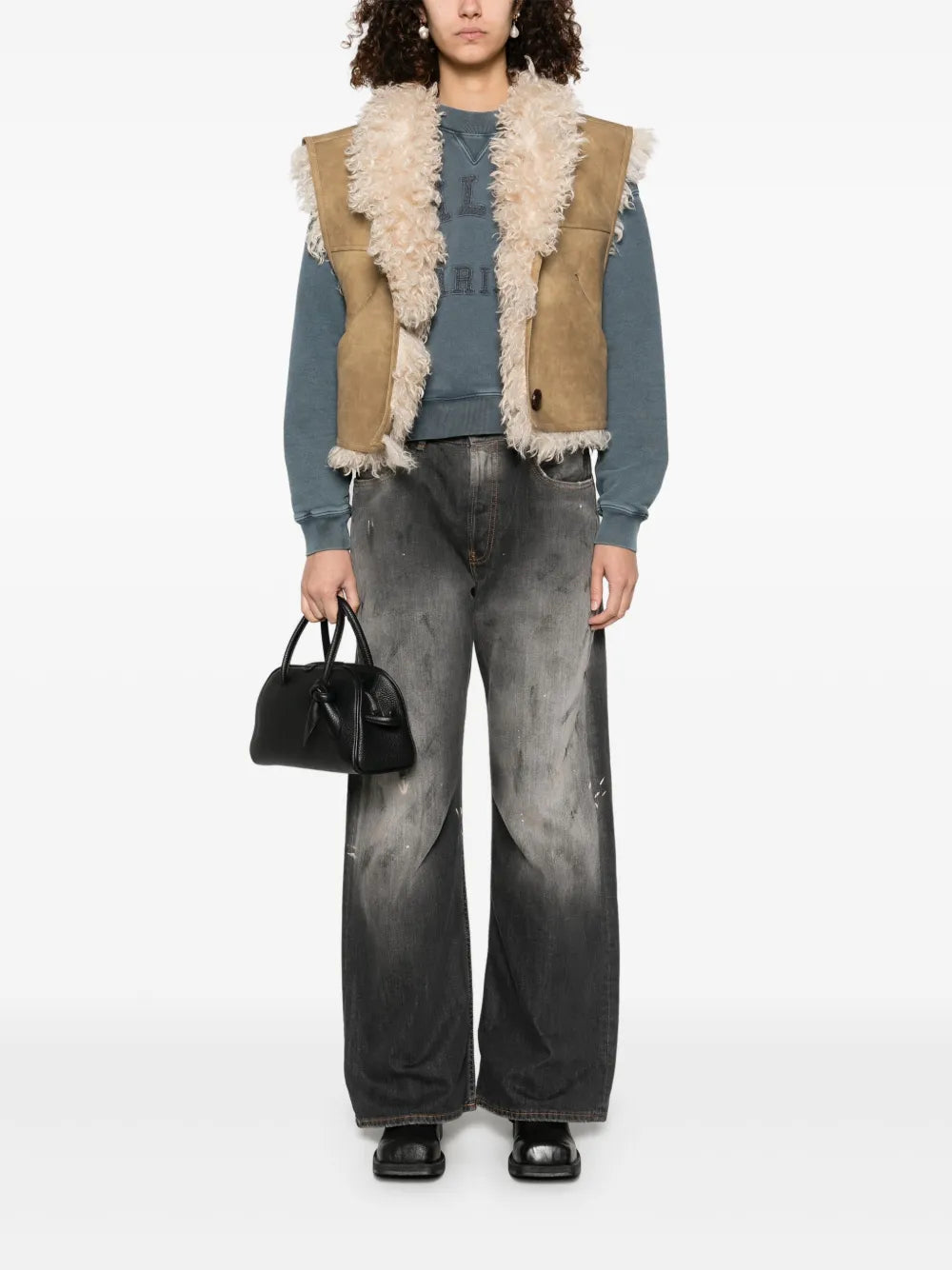 Close-up of the Clara Vest in Taupe, showcasing the buttoned front and soft texture.
