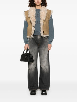 Close-up of the Clara Vest in Taupe, showcasing the buttoned front and soft texture.