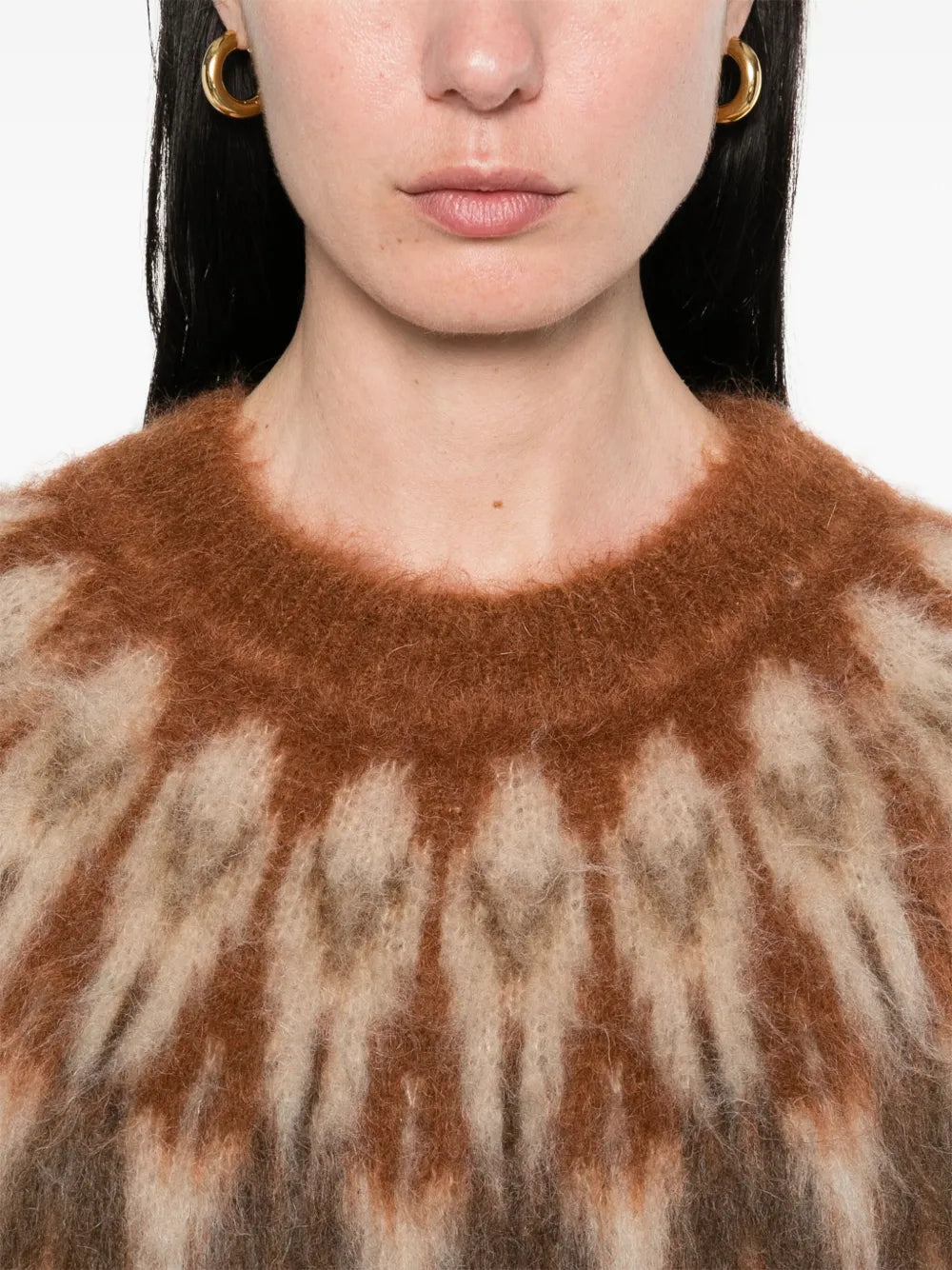 Natania Sweater in Rust displayed on a hanger showcasing the beautiful color and texture of the mohair blend.