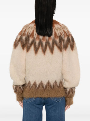 Side view of the Natania Sweater in Rust, emphasizing its relaxed silhouette and elegant details by Isabel Marant.