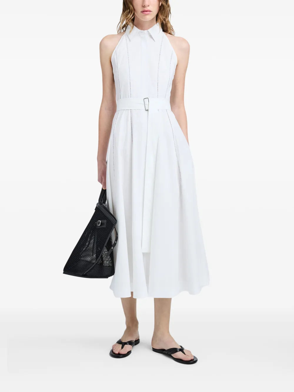 Close-up of the Dorothy Dress in White featuring eyelet trim detail and a stylish slider belt.