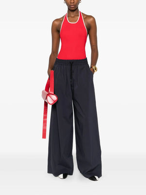 Stylish Fine Line Halter Top in Red with contrast piping and low scooped back.