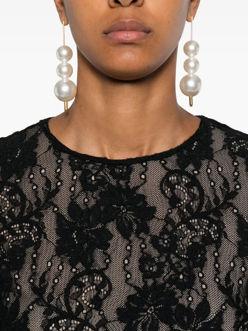 Detailed shot of the texture of the Lace Bodysuit in Black by Zimmermann, emphasizing its high-quality materials.