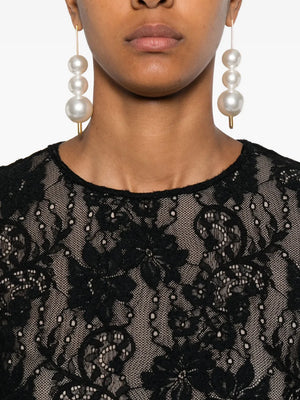 Detailed shot of the texture of the Lace Bodysuit in Black by Zimmermann, emphasizing its high-quality materials.