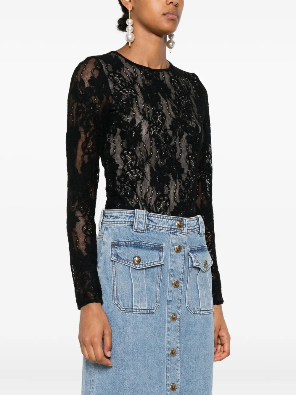 Full view of the Lace Bodysuit in Black worn by a model, perfect for stylish occasions.