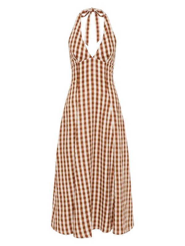 Marais Midi Dress in Gingham Cedar by Faithfull, featuring a V-neckline and halter neck ties, displayed on a model in a scenic outdoor setting.