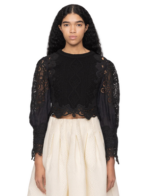 Close-up of the Vania Sweater in Black showcasing the intricate lace sleeve detailing.