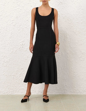 Close-up of the scoop neckline of the Hypnotic Sculptural Midi Dress in Black from Zimmermann.