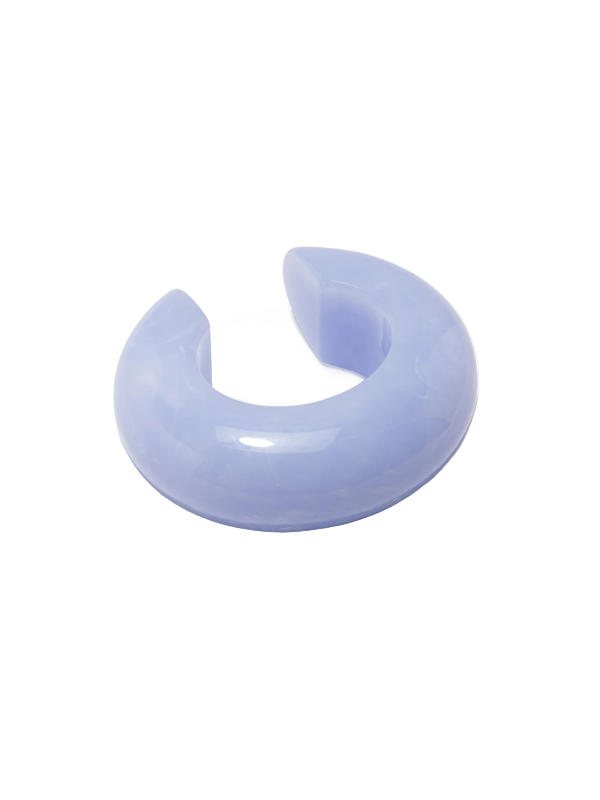Stylish Arc Cuff in Marbled Blue Lace by Lizzie Fortunato, showcasing its unique light blue resin design, perfect for stacking or wearing solo.