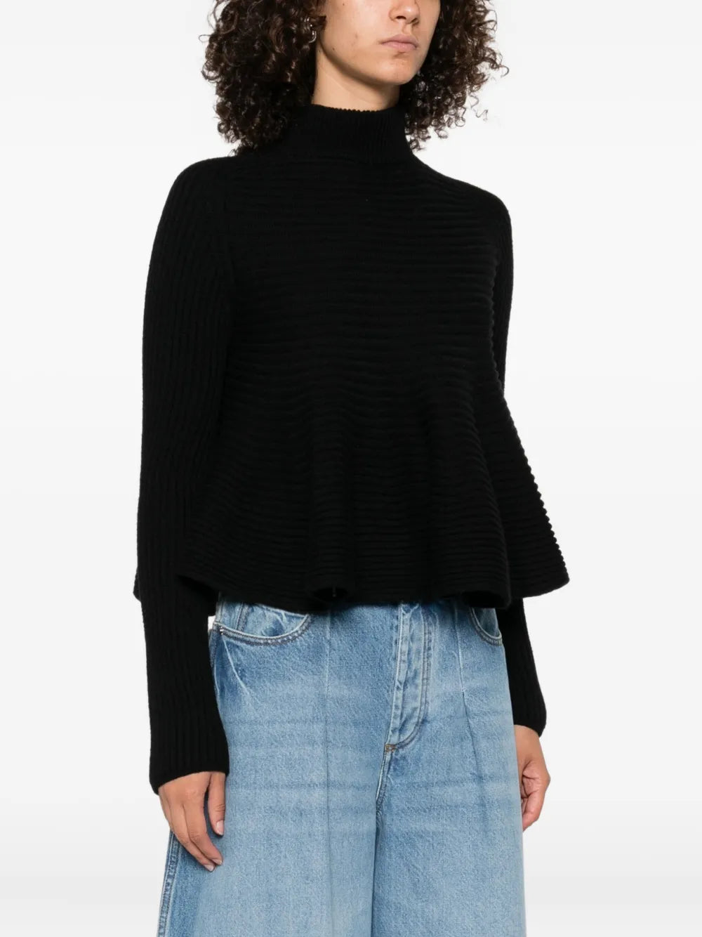 Model wearing Astice Sweater in Black by Sportmax paired with casual chic outfit