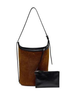 Proenza Schouler's Brant Bucket Bag in Fern worn as a crossbody bag.