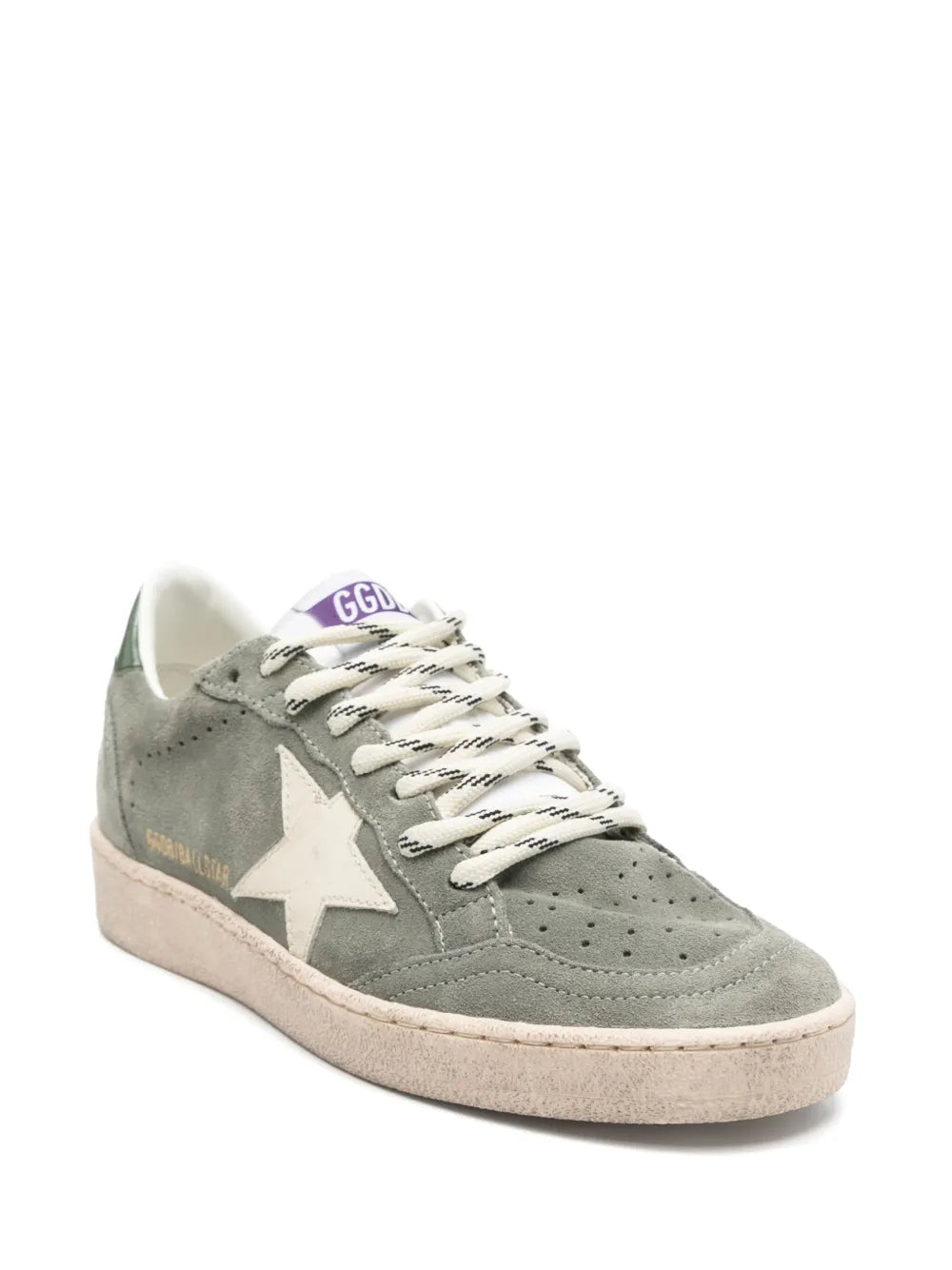 Detailed view of Golden Goose Ball Star sneakers showcasing the green shiny leather heel tab and classic white and black laces.