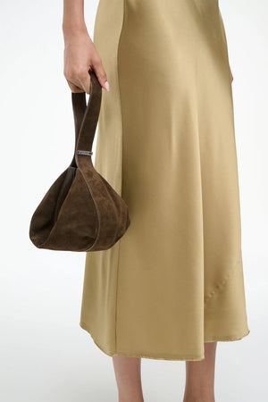 Handheld view of the Demy Shoulder Bag in Truffle, combining elegance and functionality.