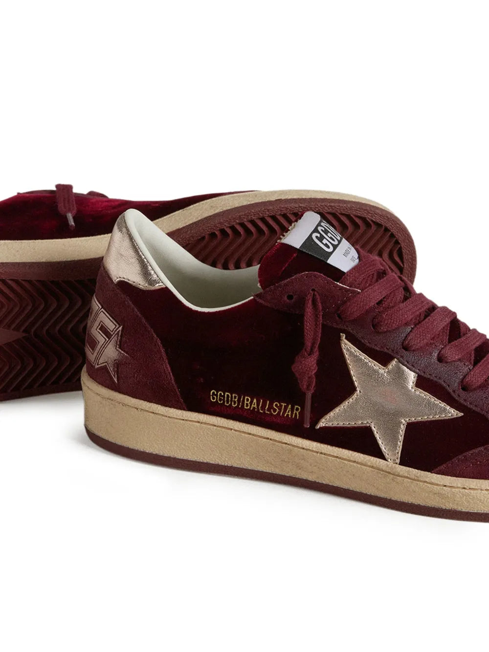 Golden Goose Ball Star in Ruby color, showcasing the sleek velvet upper and rubber sole.
