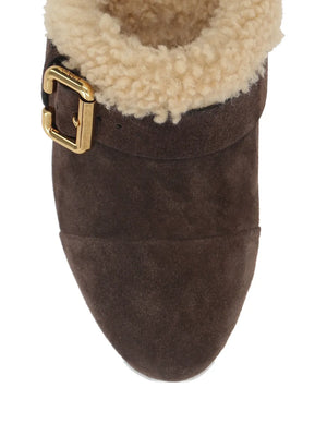 Stylish display of the Jeanette Clog in Burnt Wood on a white background, emphasizing its craftsmanship and chic appearance.