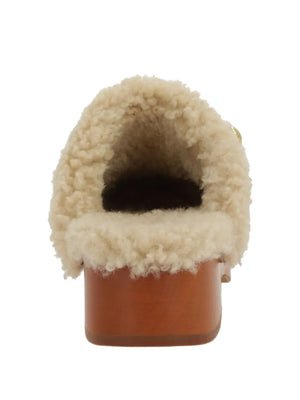 Side profile of the Jeanette Clog in Burnt Wood highlighting its luxurious calf suede and comfortable design.