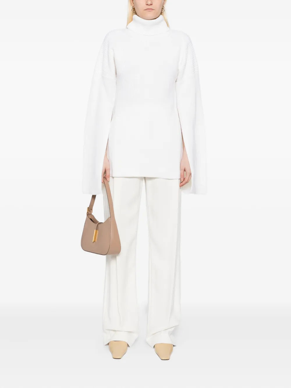 TOTEME's Slit Sleeve Knit in Ecru, a chic turtleneck sweater women made from mid-weight merino wool with a slim silhouette.