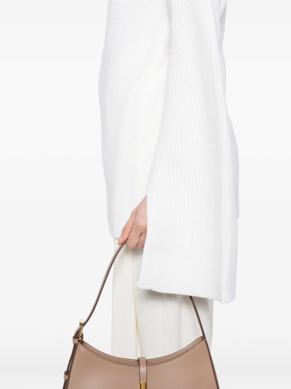Close-up of the Slit Sleeve Knit in Ecru by TOTEME, highlighting the rib-knitted texture of this turtleneck sweater women.