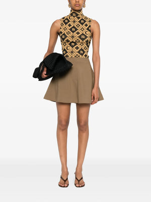 Close-up view of the Tenna Skirt in Brown highlighting the fabric texture and tailored design.
