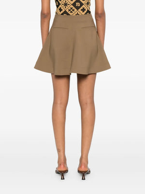 Detail shot of the Tenna Skirt in Brown featuring its elegant drape and chic A-line shape.