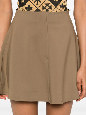 Fashionable look of the Tenna Skirt in Brown paired with accessories for a trendy outfit.