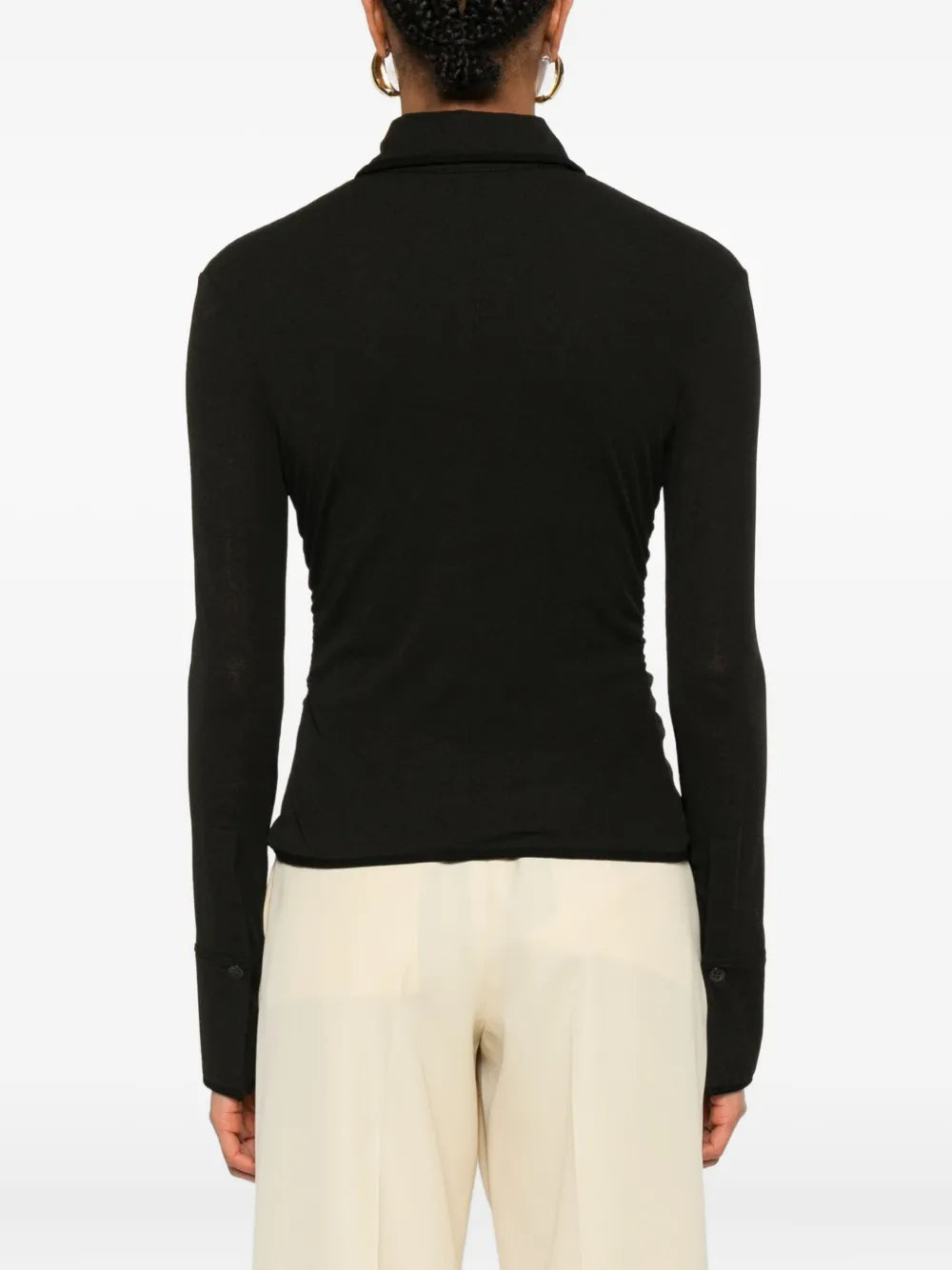 Back view of the Nanushka Idana Shirt in Black, featuring the elegant design with contrasting binding details.