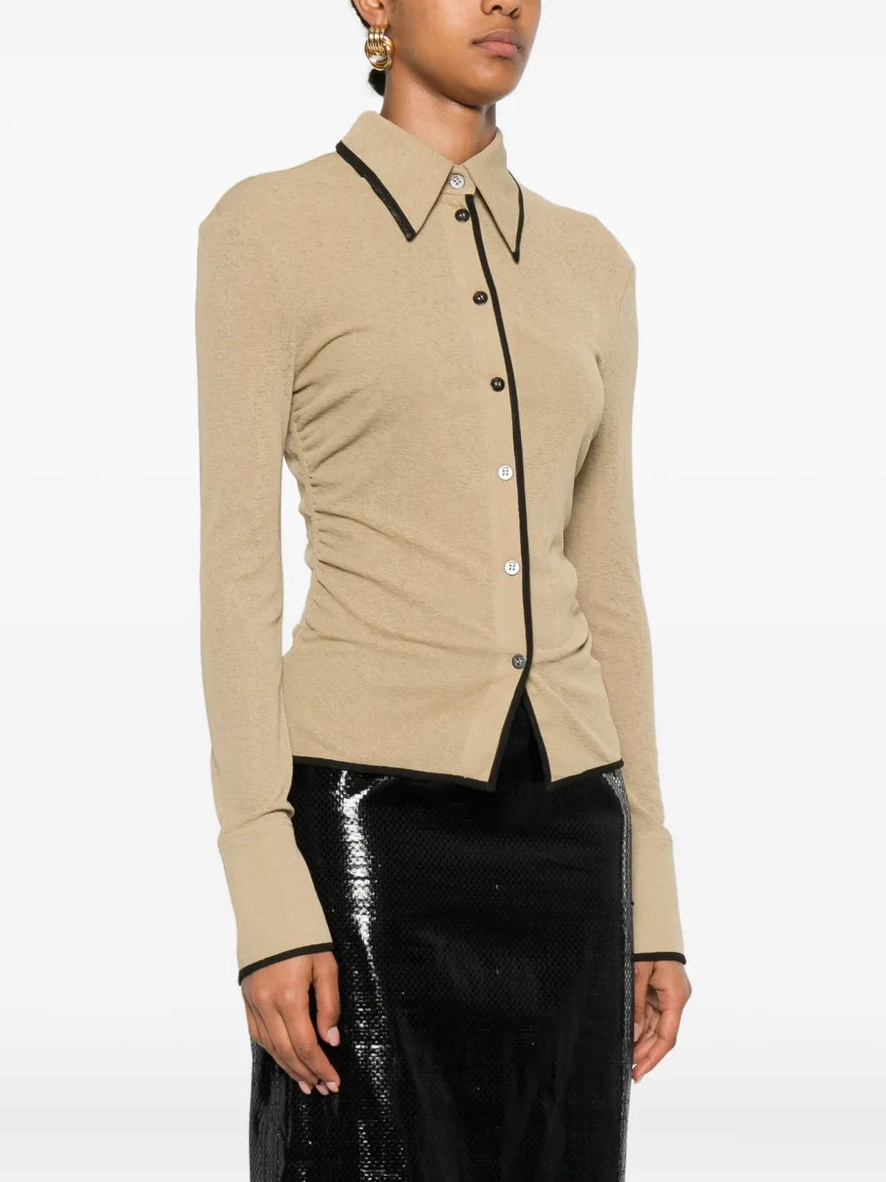 Model wearing Nanushka Idana Shirt in Sand, styled for a chic casual look.