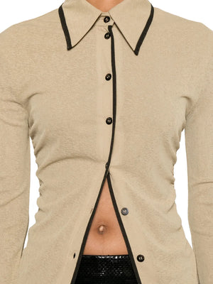 Flat lay of Nanushka Idana Shirt in Sand, featuring its soft fabric and color details.
