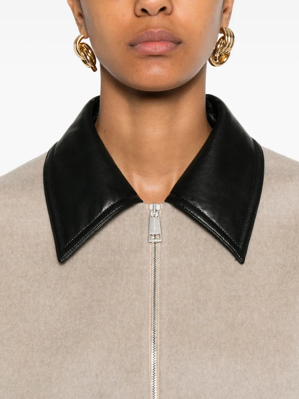 Stylish flat lay of the Phebe Jacket in Stone, featuring quality materials and designer details by Nanushka.