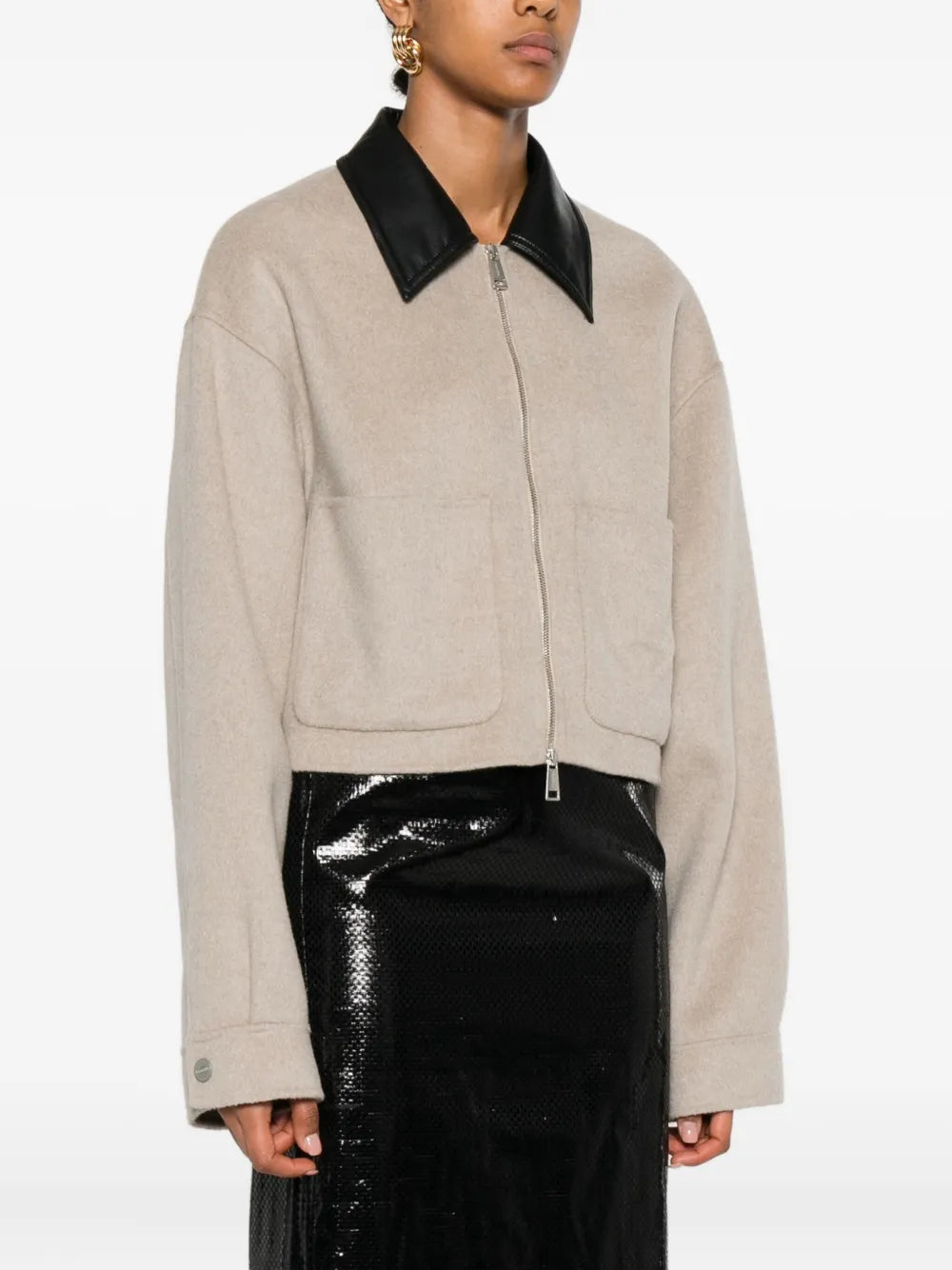 Model wearing the Phebe Jacket in Stone, highlighting the effortless style and sophistication of this Nanushka piece.