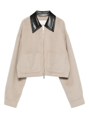 Phebe Jacket in Stone by Nanushka, showcasing the relaxed yet refined design with a black regenerated leather collar.